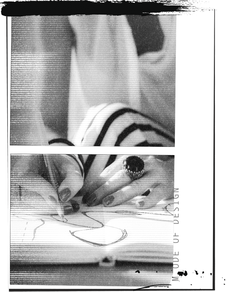 Artist sketching design concepts in a sketchbook.